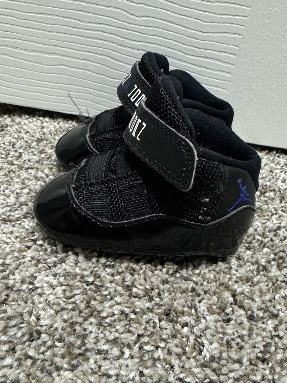 Jordan Black Infant High-Top Sneakers with Purple Jumpman Accent